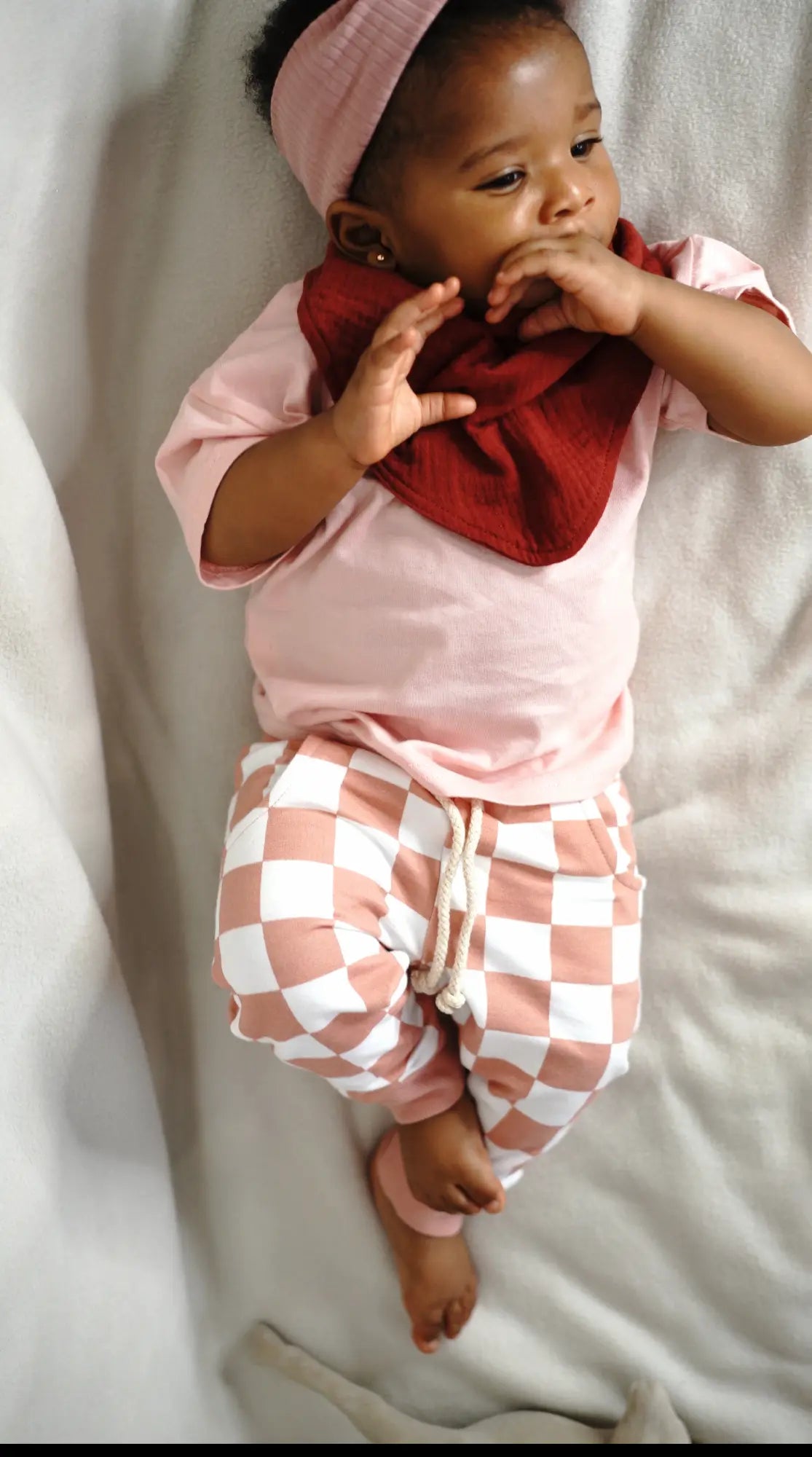Paalm Baby drea organic cotton bandana bibs set on baby in crib wearing the Lia set Nigeria