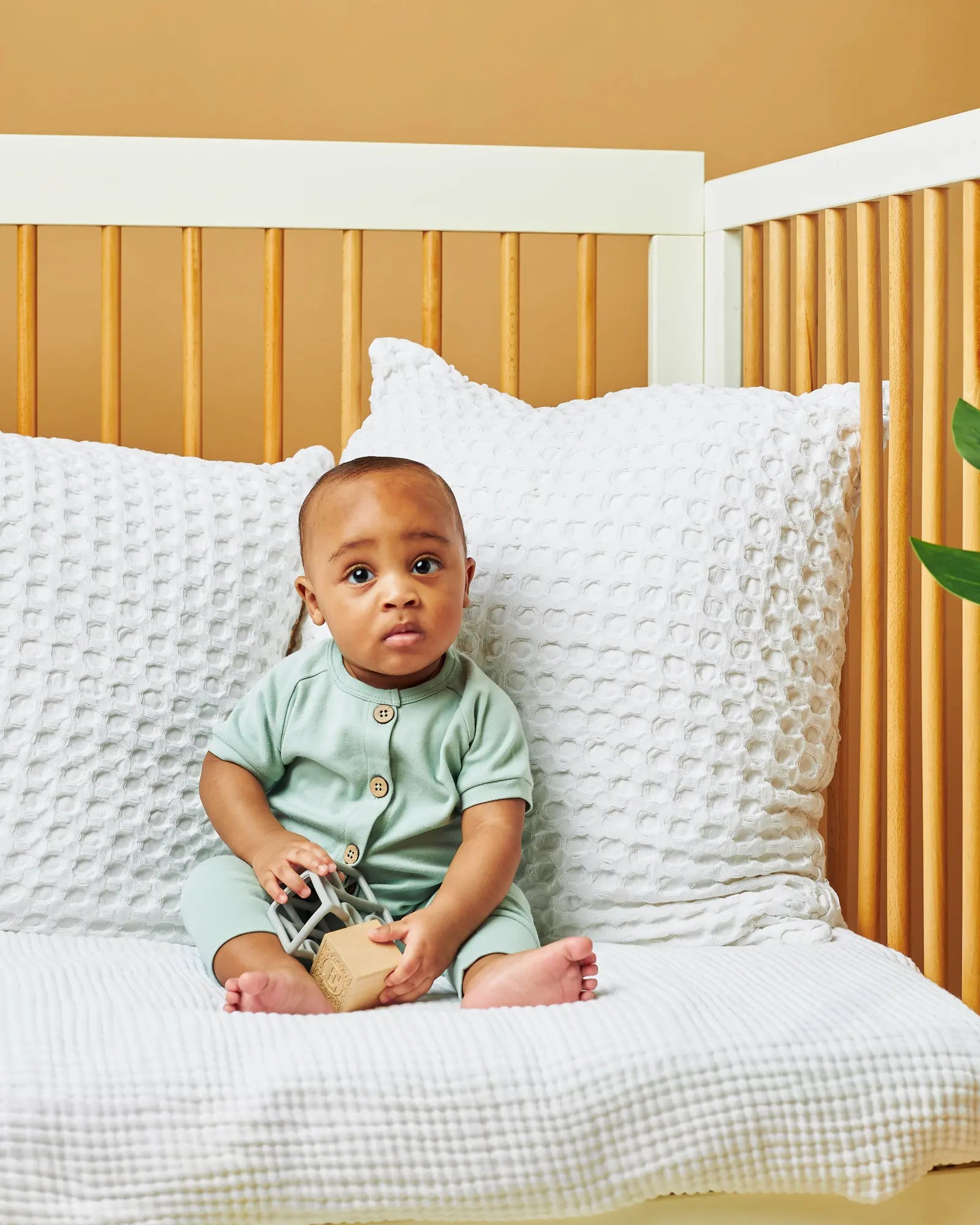 AEMI organic cotton baby pajamas with coconut shell buttons Mint on baby | Paalm Baby Clothing Nigeria