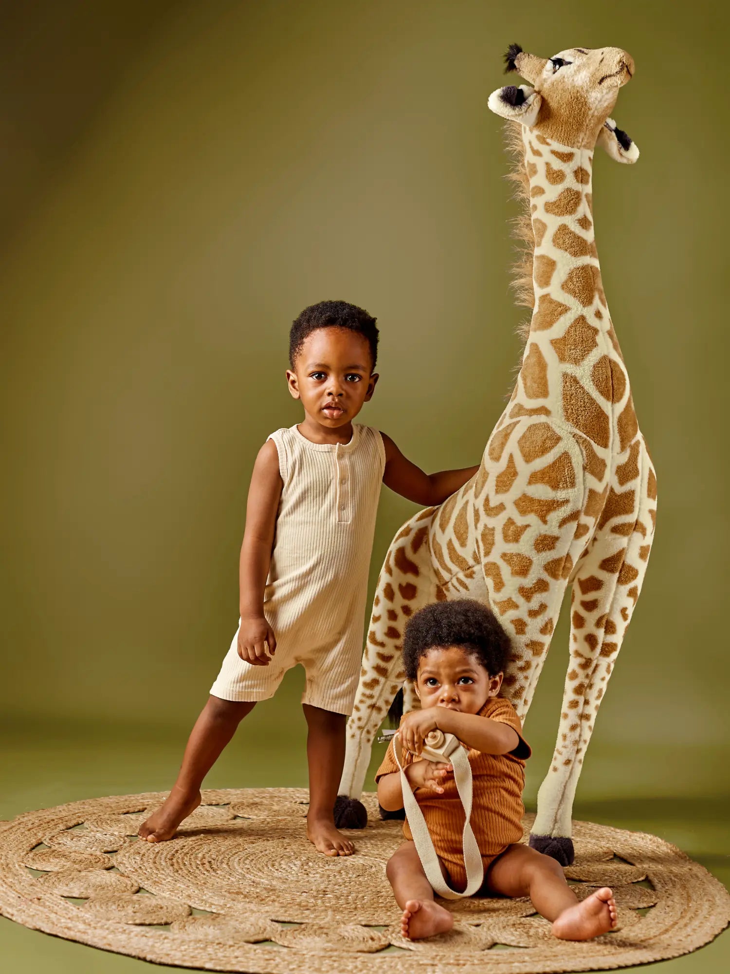 Noli organic ribbed baby romper - GOTS certified cotton modeled by a baby and a toddler| Paalm Baby Clothing Nigeria