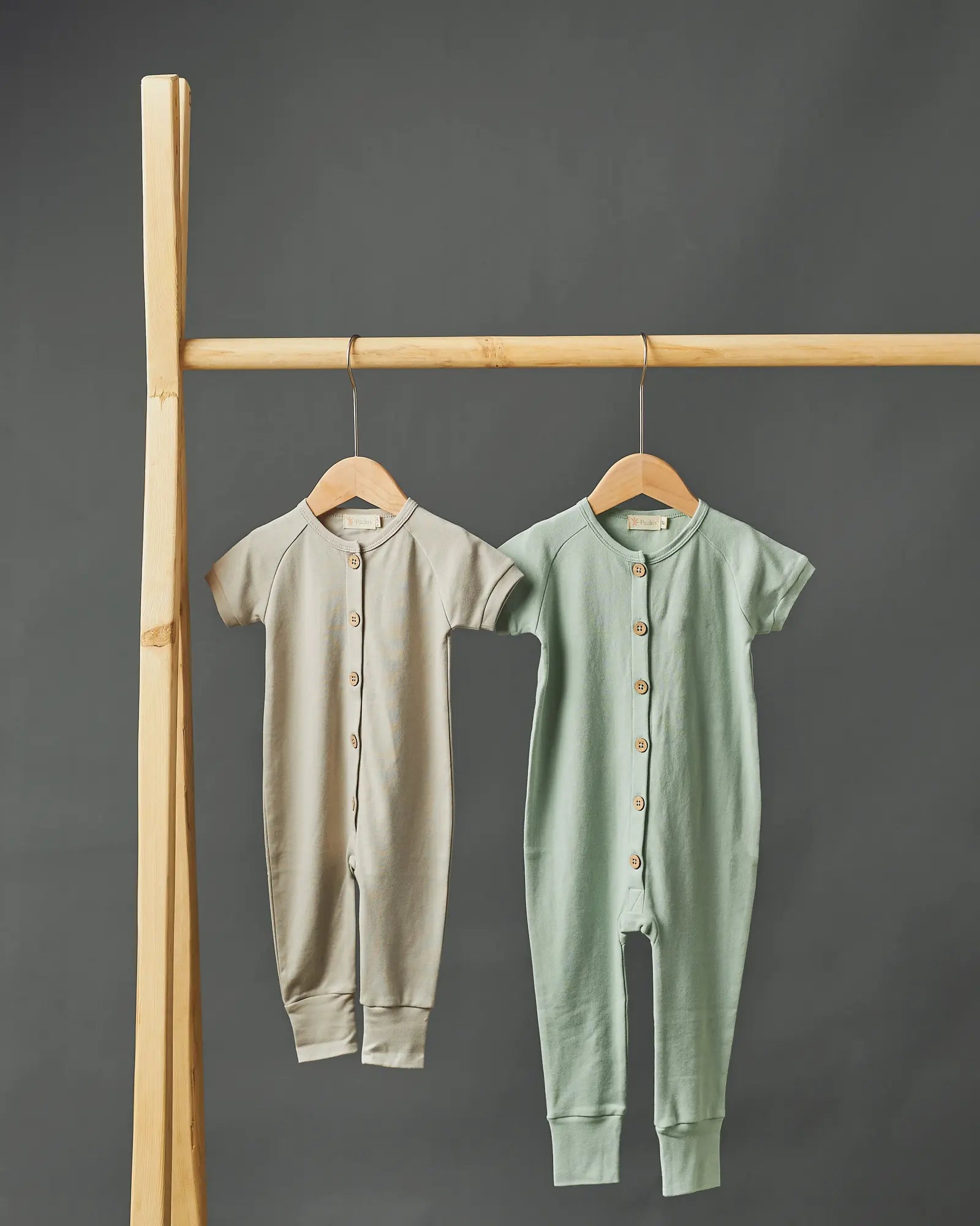 AEMI organic cotton baby pajamas with coconut shell buttons in mint and smoke | Paalm Baby Clothing Nigeria