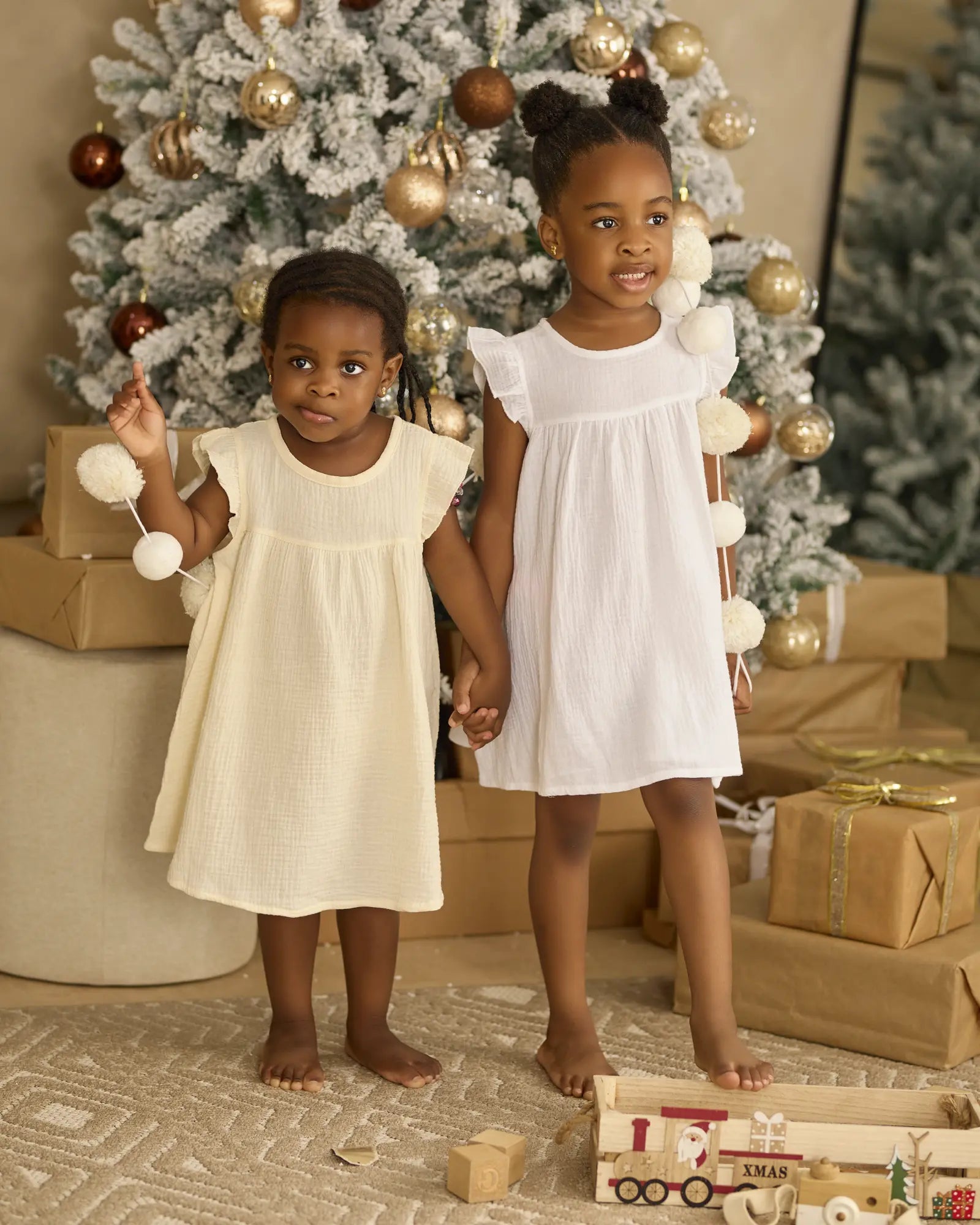 Ailee organic cotton baby girl dress with ruffles shown in Cloud and Magnolia | Paalm Baby Clothing Nigeria
