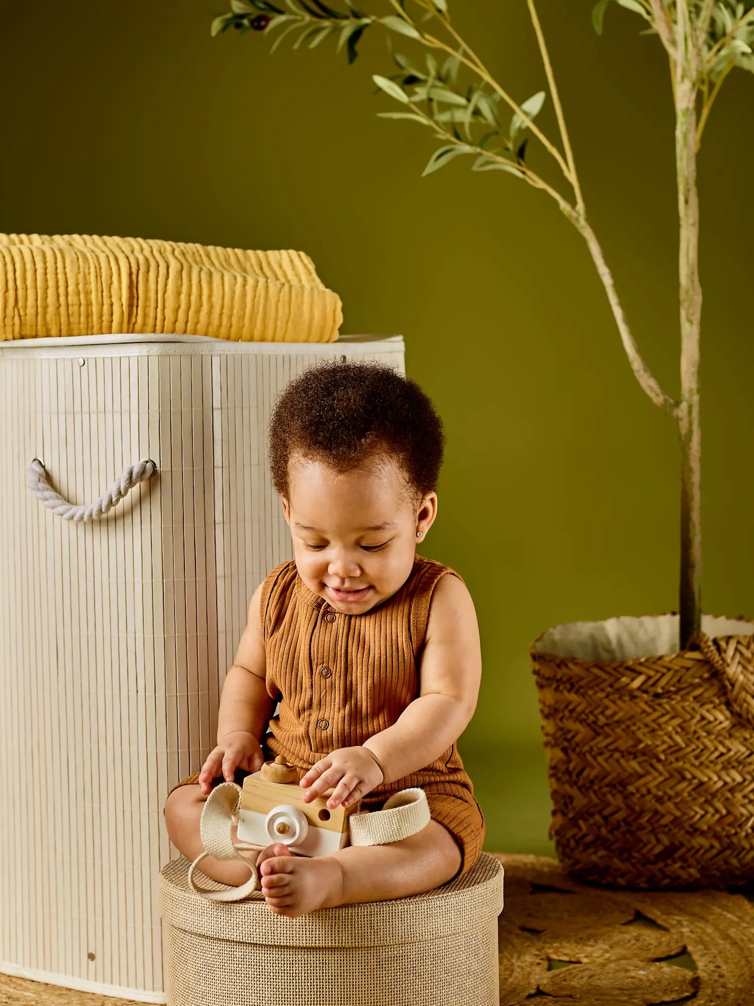 Noli organic ribbed baby romper - GOTS certified cotton cinnamon on a sitting baby | Paalm Baby Clothing Nigeria